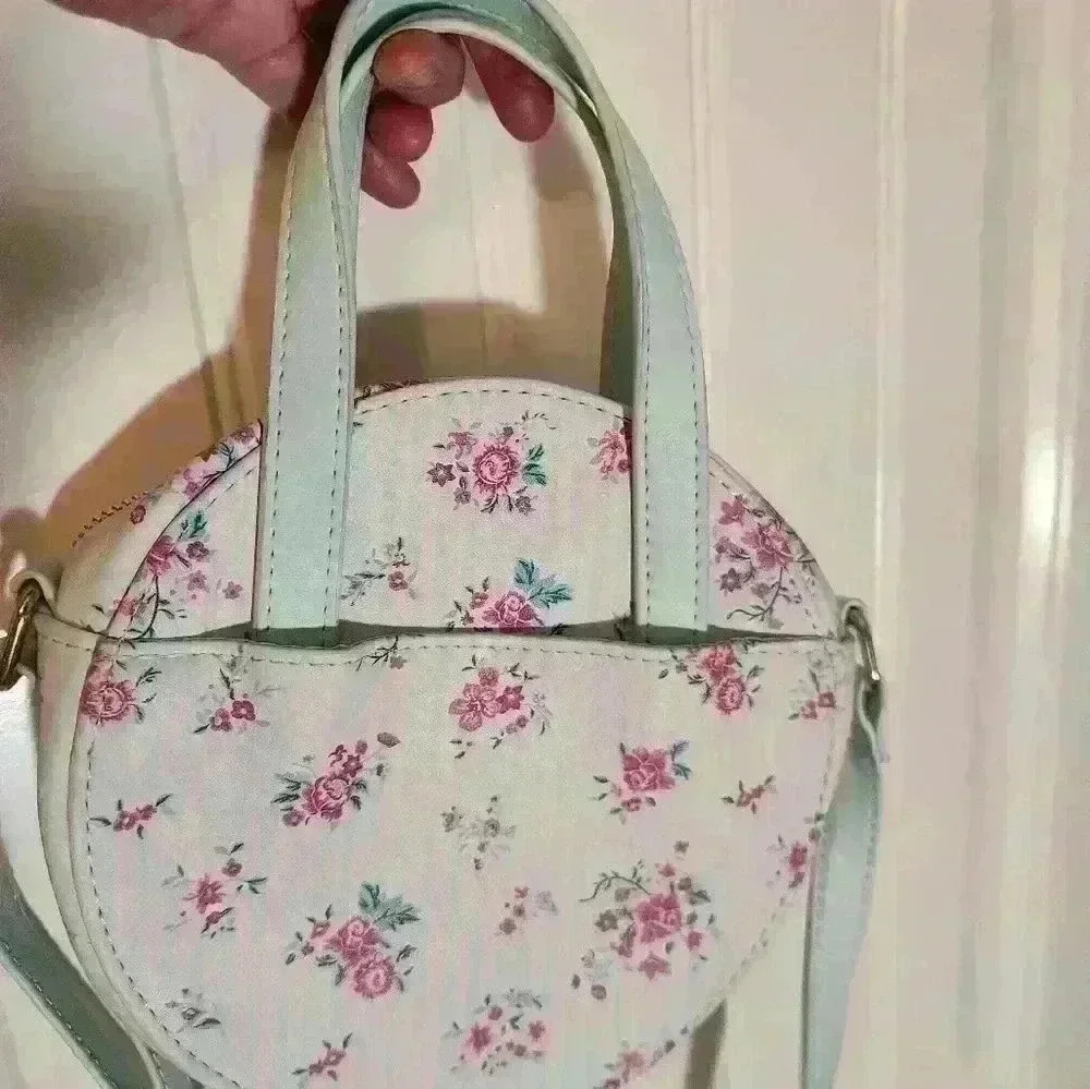 Mint green with detail silk lining.Round Purse with over shoulder and hand strap - Picture 2 of 10